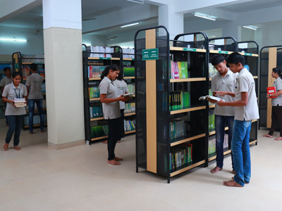 Students browsing books in library